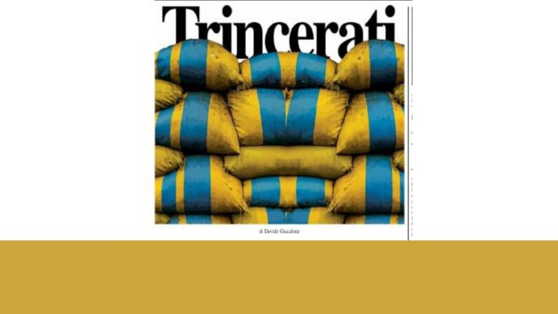 Trincerati Prima pagina con titolo “Trincerati” e immagine di sacchi di sabbia gialli e blu, colori della bandiera ucraina, a simboleggiare la resistenza europea nella guerra contro la Russia.